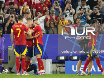 Dani Olmo attacking midfield of Spain and RB Leipzig celebrates after scoring his sides first goal during the UEFA EURO 2024 semi-final matc...