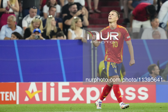 Dani Olmo attacking midfield of Spain and RB Leipzig celebrates after scoring his sides first goal during the UEFA EURO 2024 semi-final matc...