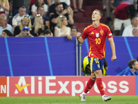 Dani Olmo attacking midfield of Spain and RB Leipzig celebrates after scoring his sides first goal during the UEFA EURO 2024 semi-final matc...