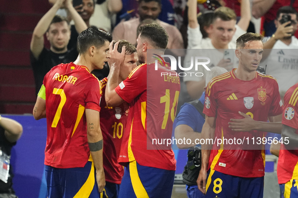 Dani Olmo attacking midfield of Spain and RB Leipzig celebrates after scoring his sides first goal during the UEFA EURO 2024 semi-final matc...