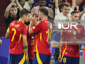 Dani Olmo attacking midfield of Spain and RB Leipzig celebrates after scoring his sides first goal during the UEFA EURO 2024 semi-final matc...