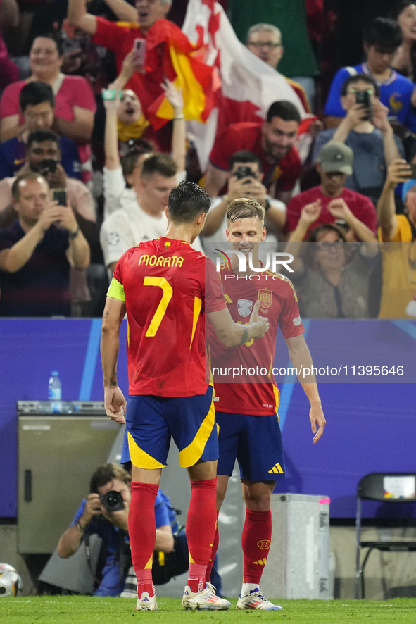 Dani Olmo attacking midfield of Spain and RB Leipzig celebrates after scoring his sides first goal during the UEFA EURO 2024 semi-final matc...