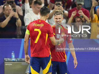 Dani Olmo attacking midfield of Spain and RB Leipzig celebrates after scoring his sides first goal during the UEFA EURO 2024 semi-final matc...