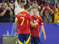 Dani Olmo attacking midfield of Spain and RB Leipzig celebrates after scoring his sides first goal during the UEFA EURO 2024 semi-final matc...