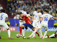 Alvaro Morata centre-forward of Spain and Atletico de Madrid surrounded by french players during the UEFA EURO 2024 semi-final match between...