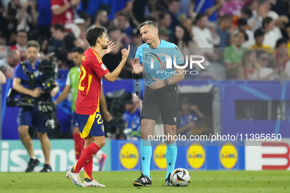 Jesus Navas right-back of Spain and Sevilla FC protest to referee during the UEFA EURO 2024 semi-final match between Spain v France at Munic...