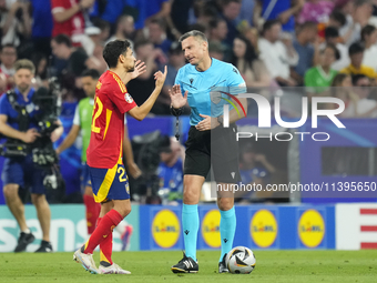 Jesus Navas right-back of Spain and Sevilla FC protest to referee during the UEFA EURO 2024 semi-final match between Spain v France at Munic...