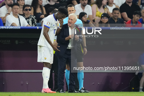 Didier Deschamps head coach of France gives instructions to Aurelien Tchouameni defensive midfield of France and Real Madrid during the UEFA...