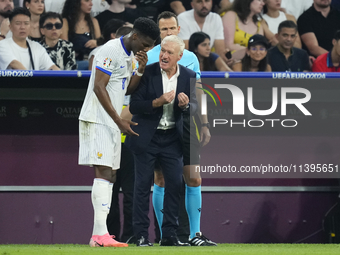 Didier Deschamps head coach of France gives instructions to Aurelien Tchouameni defensive midfield of France and Real Madrid during the UEFA...