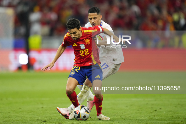 Jesus Navas right-back of Spain and Sevilla FC and William Saliba centre-back of France and Arsenal FC compete for the ball during the UEFA...