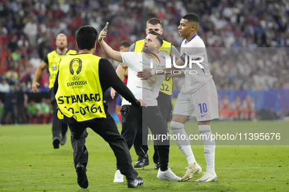 Pitch onvader with Kylian Mbappe centre-forward of France and Real Madrid during the UEFA EURO 2024 semi-final match between Spain v France...