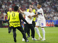 Pitch onvader with Kylian Mbappe centre-forward of France and Real Madrid during the UEFA EURO 2024 semi-final match between Spain v France...