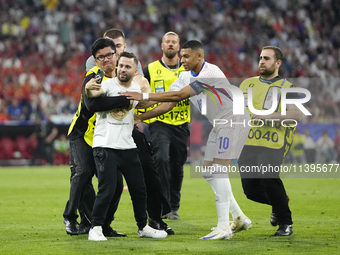 Pitch onvader with Kylian Mbappe centre-forward of France and Real Madrid during the UEFA EURO 2024 semi-final match between Spain v France...