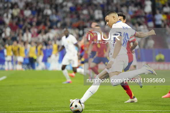 Kylian Mbappe centre-forward of France and Real Madrid shooting to goal during the UEFA EURO 2024 semi-final match between Spain v France at...