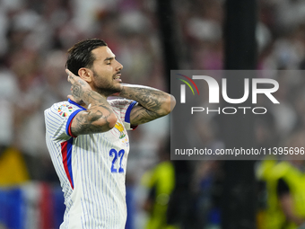 Theo Hernandez eft-back of France and AC Milanlament a failed occasion during the UEFA EURO 2024 semi-final match between Spain v France at...