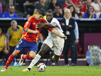 Alvaro Morata centre-forward of Spain and Atletico de Madrid and Dayot Upamecano centre-back of France and Bayern Munich compete for the bal...