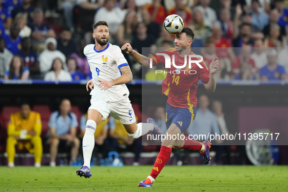 Aymeric Laporte centre-back of Spain and Al-Nassr FC and Olivier Giroud centre-forward of France and AC Milan compete for the ball during th...