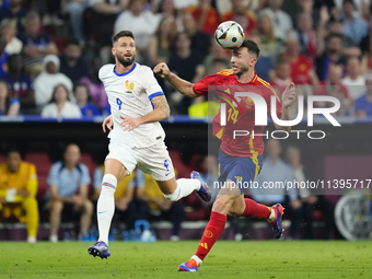 Aymeric Laporte centre-back of Spain and Al-Nassr FC and Olivier Giroud centre-forward of France and AC Milan compete for the ball during th...