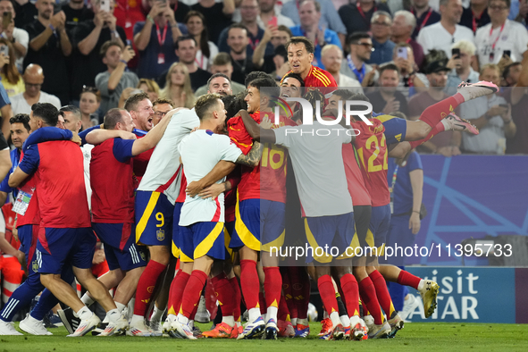 Spanish players celebrate victory after the UEFA EURO 2024 semi-final match between Spain v France at Munich Football Arena on July 9, 2024...