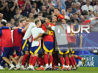 Spanish players celebrate victory after the UEFA EURO 2024 semi-final match between Spain v France at Munich Football Arena on July 9, 2024...