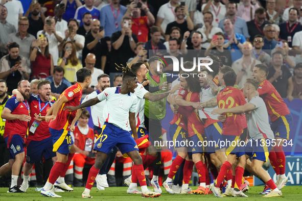 Spanish players celebrate victory after the UEFA EURO 2024 semi-final match between Spain v France at Munich Football Arena on July 9, 2024...