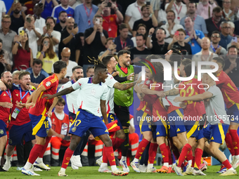 Spanish players celebrate victory after the UEFA EURO 2024 semi-final match between Spain v France at Munich Football Arena on July 9, 2024...