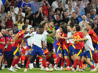 Spanish players celebrate victory after the UEFA EURO 2024 semi-final match between Spain v France at Munich Football Arena on July 9, 2024...