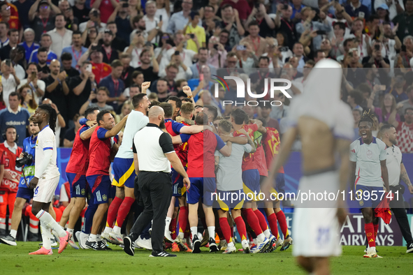 Spanish players celebrate victory after the UEFA EURO 2024 semi-final match between Spain v France at Munich Football Arena on July 9, 2024...