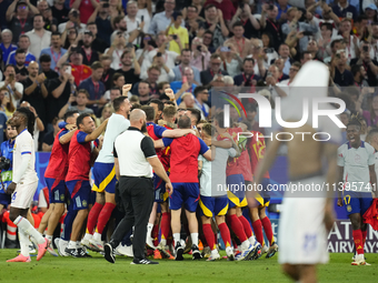 Spanish players celebrate victory after the UEFA EURO 2024 semi-final match between Spain v France at Munich Football Arena on July 9, 2024...