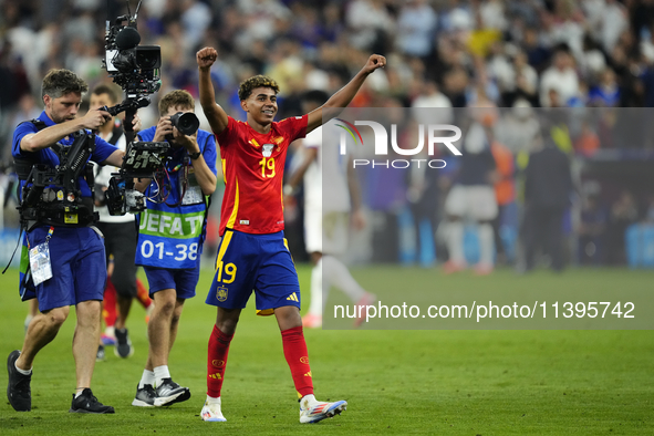 Lamine Yamal right winger of Spain and FC Barcelona celebrates victory after the UEFA EURO 2024 semi-final match between Spain v France at M...