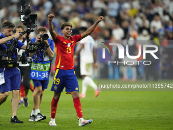 Lamine Yamal right winger of Spain and FC Barcelona celebrates victory after the UEFA EURO 2024 semi-final match between Spain v France at M...