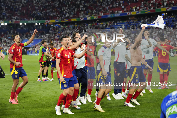 Spanish players celebrate victory after the UEFA EURO 2024 semi-final match between Spain v France at Munich Football Arena on July 9, 2024...