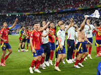 Spanish players celebrate victory after the UEFA EURO 2024 semi-final match between Spain v France at Munich Football Arena on July 9, 2024...