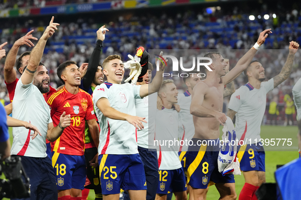 Spanish players celebrate victory after the UEFA EURO 2024 semi-final match between Spain v France at Munich Football Arena on July 9, 2024...