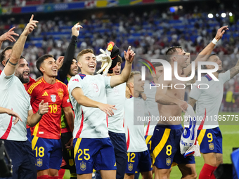 Spanish players celebrate victory after the UEFA EURO 2024 semi-final match between Spain v France at Munich Football Arena on July 9, 2024...