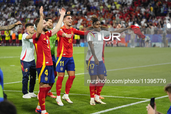 Spanish players celebrate victory after the UEFA EURO 2024 semi-final match between Spain v France at Munich Football Arena on July 9, 2024...