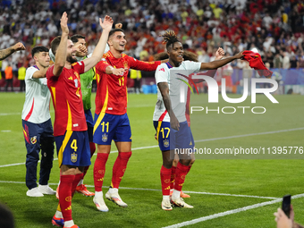 Spanish players celebrate victory after the UEFA EURO 2024 semi-final match between Spain v France at Munich Football Arena on July 9, 2024...