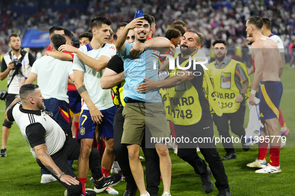 Security personnel injure Alvaro Morata centre-forward of Spain and Atletico de Madrid when antry a pitch invader after the UEFA EURO 2024 s...