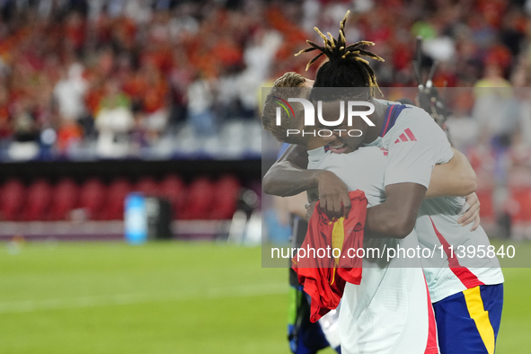 Nico Williams left winger of Spain and Athletic Club Bilbao celebrates victory after the UEFA EURO 2024 semi-final match between Spain v Fra...