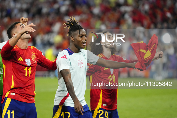 Lamine Yamal right winger of Spain and FC Barcelona and Marc Cucurella left-back of Spain and Chelsea FC celebrate victory after the UEFA EU...