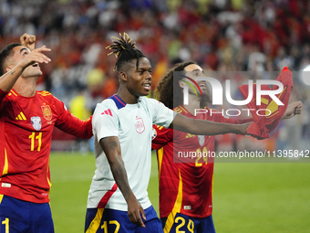 Lamine Yamal right winger of Spain and FC Barcelona and Marc Cucurella left-back of Spain and Chelsea FC celebrate victory after the UEFA EU...