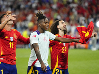 Lamine Yamal right winger of Spain and FC Barcelona and Marc Cucurella left-back of Spain and Chelsea FC celebrate victory after the UEFA EU...