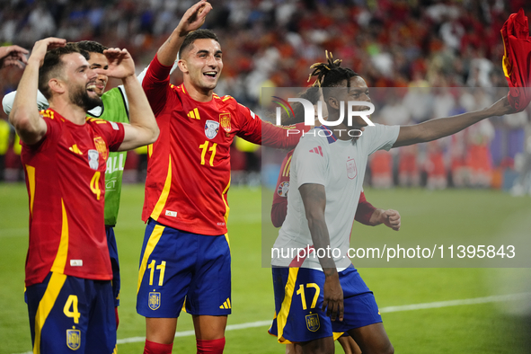 Ferran Torres left winger of Spain and FC Barcelona and Nico Williams left winger of Spain and Athletic Club Bilbao celebrate victory after...