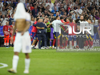 Spanish players celebrate victory after the UEFA EURO 2024 semi-final match between Spain v France at Munich Football Arena on July 9, 2024...