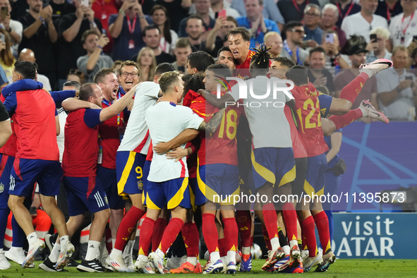 Spanish players celebrate victory after the UEFA EURO 2024 semi-final match between Spain v France at Munich Football Arena on July 9, 2024...