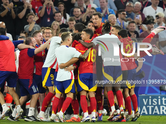 Spanish players celebrate victory after the UEFA EURO 2024 semi-final match between Spain v France at Munich Football Arena on July 9, 2024...