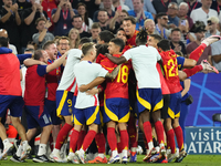 Spanish players celebrate victory after the UEFA EURO 2024 semi-final match between Spain v France at Munich Football Arena on July 9, 2024...