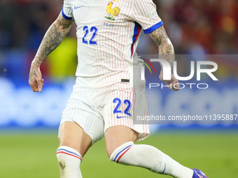 Theo Hernandez eft-back of France and AC Milan during the UEFA EURO 2024 semi-final match between Spain v France at Munich Football Arena on...