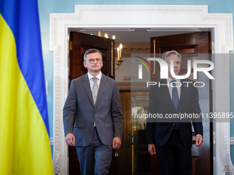 Foreign Minister Dmytro Kuleba of Ukraine (left) and Secretary of State Antony Blinken make statements to the press following a meeting at t...