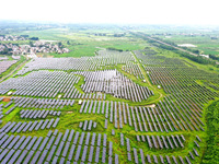 A photovoltaic power station is being shown in Ligang village, Chaohu city, East China's Anhui province, on July 9, 2024. (